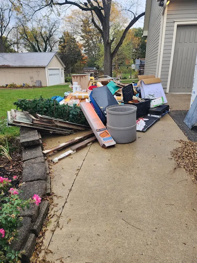 Dumpster being loaded with debris for Residential Dumpster Rental in Highgate